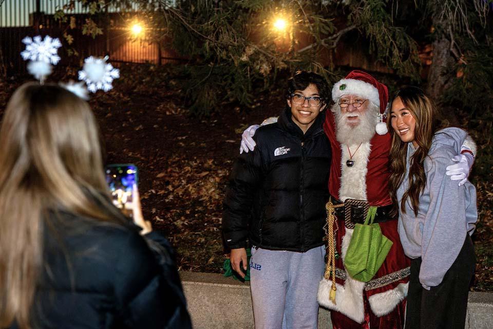 Christmas on the Quad attendees enjoy the festivities. Photo by Sarah Conroy.