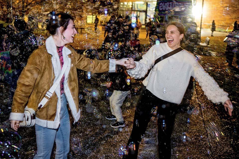 Christmas on the Quad attendees enjoy the festivities. Photo by Sarah Conroy.